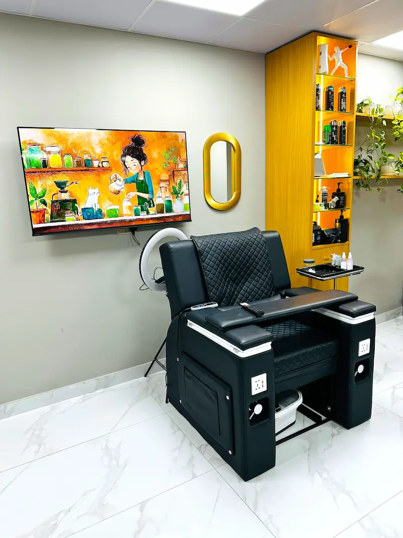 modern barber chair and interior at Kings Afro Barbershop in JVC Dubai